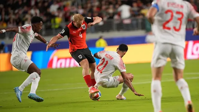 Xaver Schlager of Austria in action against Nizar al-Rashdan of Jordan