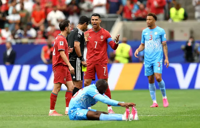 Cristiano Ronaldo #7 of Portugal argues with referee Abdulrahman Al Jassim