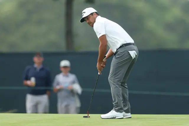 Xander Schauffele makes a putt