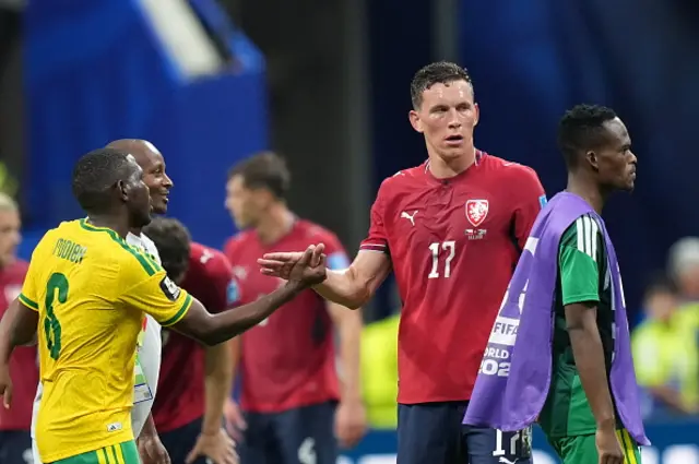 Lukas Provod of Czechia greets Aubrey Modiba of South Afric