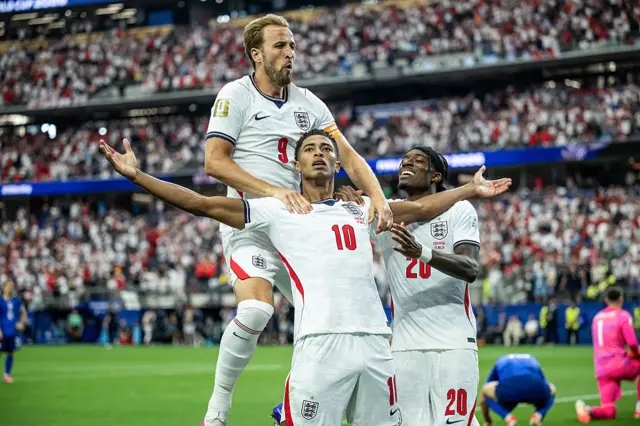 Jude Bellingham of England celebrates after scoring his team's third goal with Harry Kane