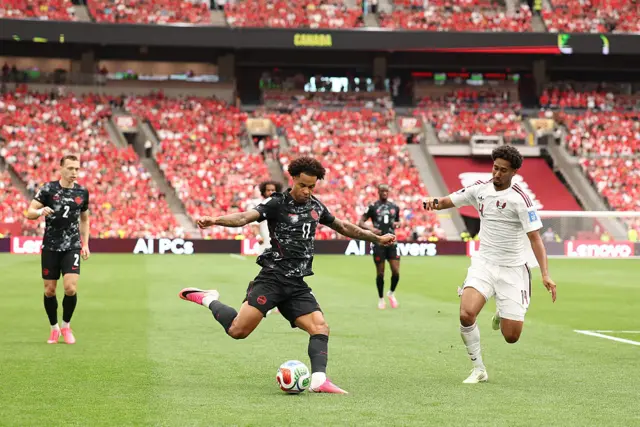 Cyle Larin #9 of Canada celebrates with teammates after scoring his team's first goal during the FIFA World Cup 2026 Group B match between Canada and Qata