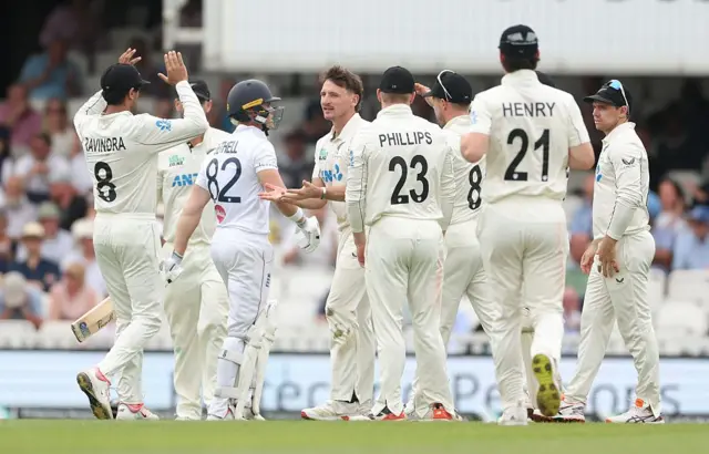 New Zealand team celebrate getting another wicket, Bethell out.
