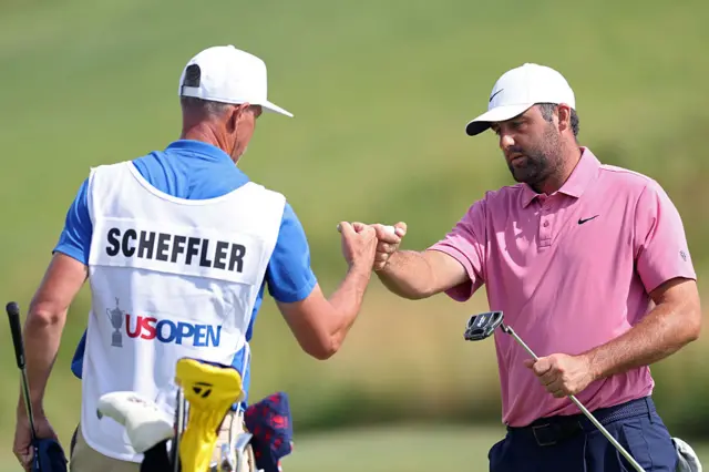Scottie Scheffler fist bumps Ted Scott