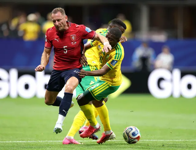 Vladimir Coufal is challenged by Aubrey Modiba