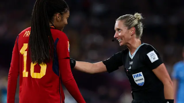 American Tori Penso speaks to a Spain player