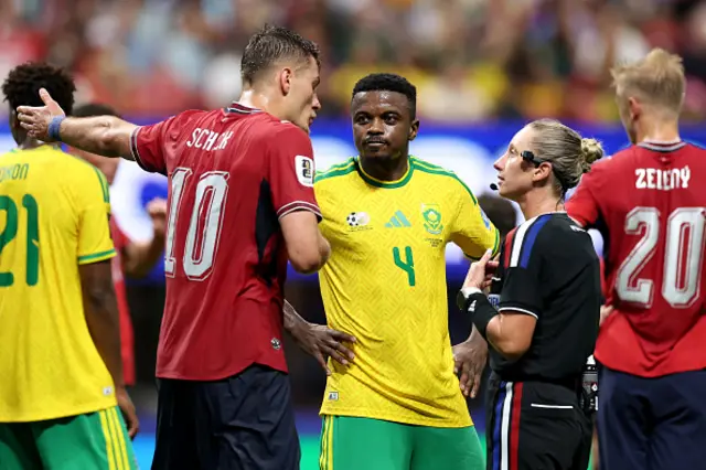 Patrik Schick of Czechia argues a call with referee Tori Penso