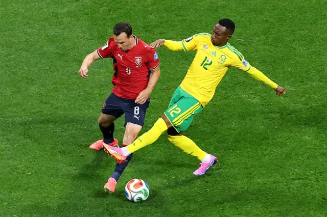 Vladimir Darida is challenged by Thapelo Maseko