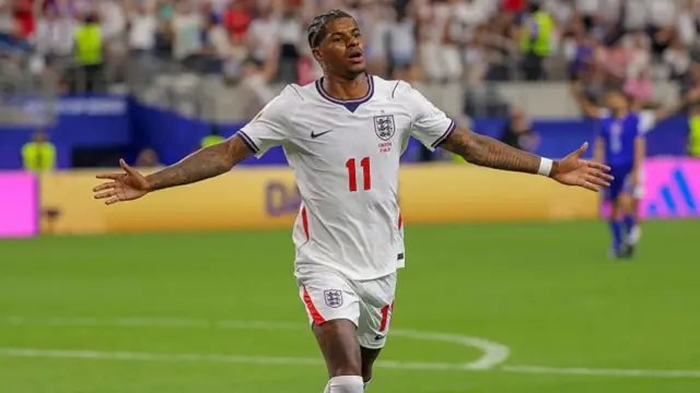 Marcus Rashford #11 of England celebrates scoring his team's fourth goal d