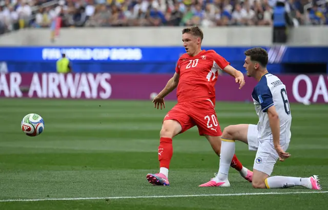 Michel Aebischer and Benjamin Tahirovic fight for the ball