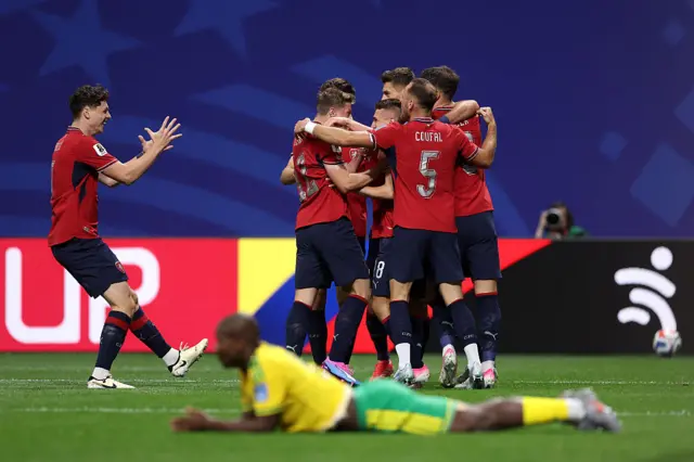 Michal Sadilek celebrates with teammates