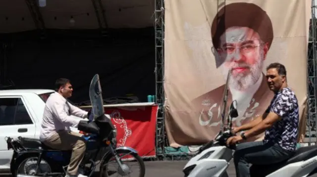 a billboard of Iranian supreme leader Ayatollah Mojtaba Khamenei at Valiasr Square in Tehran, Iran