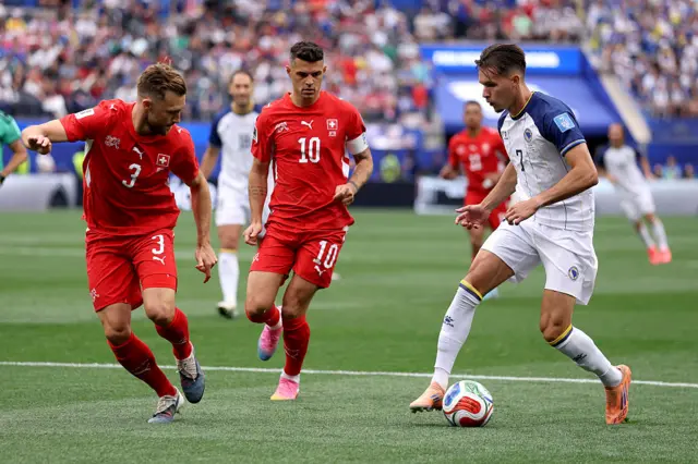 Amar Dedic controls the ball under pressure from Silvan Widmer