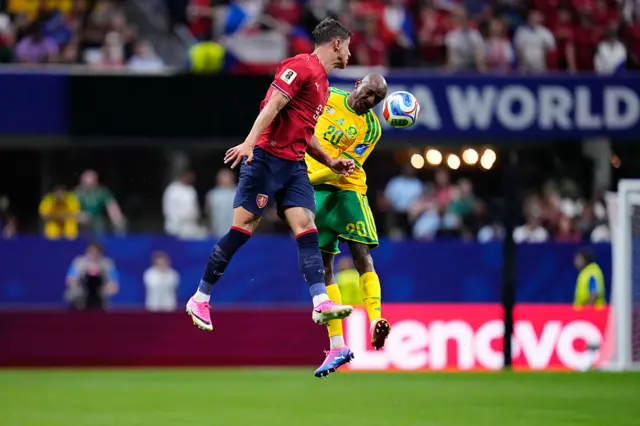 Adam Hlozek and Khuliso Mudau compete for the ball