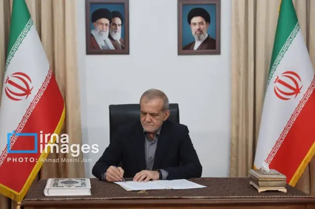 Iranian president Masoud Pezeshkian signing the memorandum of understanding