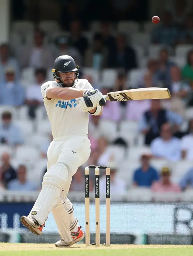 Glenn Phillips swings bat to his left-hitting 50 runs