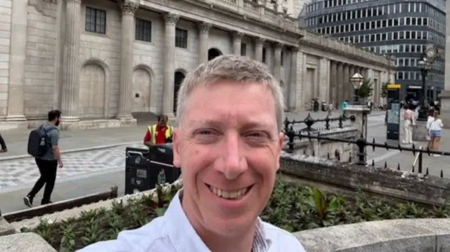 BBC cost of living reporter Kevin Peachey stands outside the Bank of England