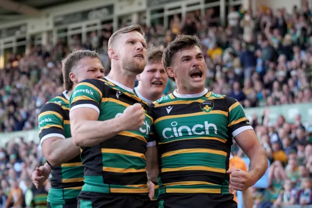 Northampton Saints players celebrate a try at Franklin's Gardens