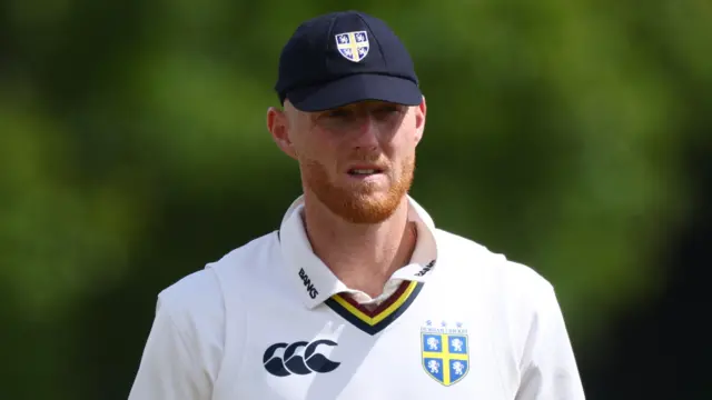Ben Stokes wearing a navy Durham cap and county whites