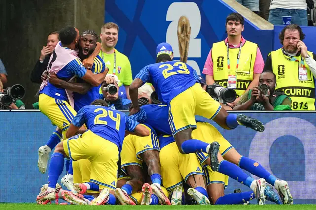 ivano Comenencia of Curaçao celebrates a goal with his teammates