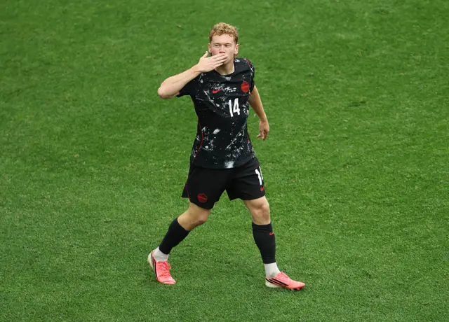 acob Shaffelburg #14 of Canada celebrates the team's fifth goal scored own goal by Mohamed Manai #26 of Qatar during the FIFA World Cup 2026 Group B match between Canada and Qatar