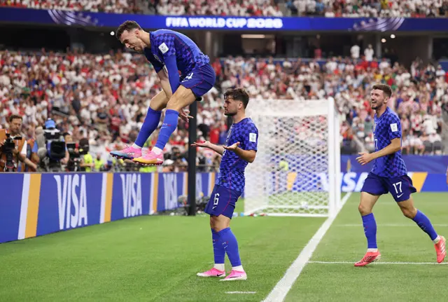 Martin Baturina of Croatia celebrates with Ivan Perisic