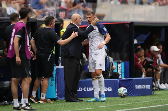 Sergej Barbarez, Head Coach of Bosnia and Herzegovina, embraces Edin Dzeko