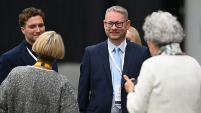 SNP candidate Richard Gordon Thomson arrives at the count to a downbeat welcome