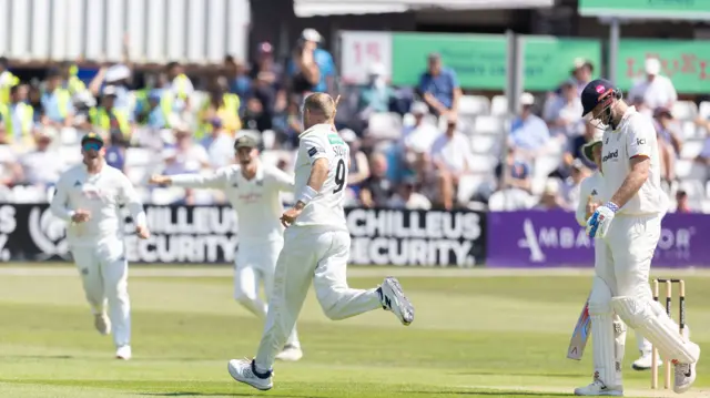 Olly Stone runs off to celebrate taking the wicket of Paul Walter as the batsman walks off with his head down