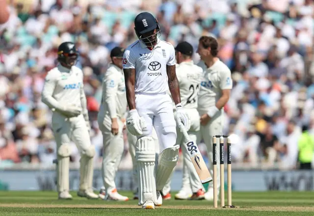Dejected looking Jofra Archer leaves the pitch after being dismissed