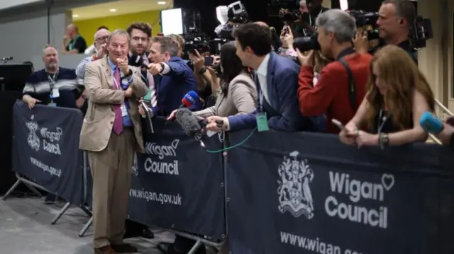 Rupert Lowe chatting to journalists in Wigan