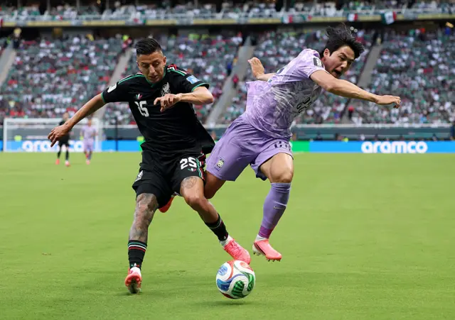 Roberto Alvarado #25 of Mexico and Young-Woo Seol #22 of Korea Republic compete for the ball during the FIFA World Cup 2026 Group A match between Mexico and Korea