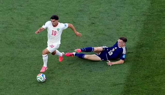 Brahim Diaz runs away from Scott McTominay