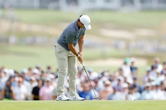 Rory McIlroy attempts a putt