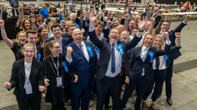 Scottish Conservative Party MSP Douglas Lumsden (front row centre) celebrates with supporters.
