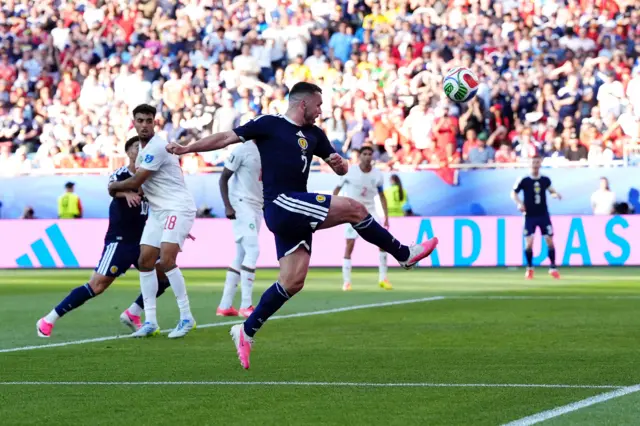 John McGinn shoots