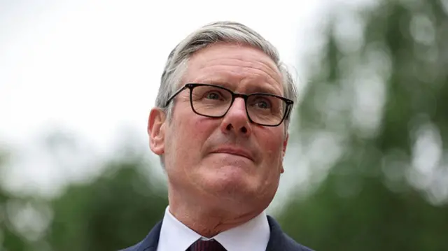 Keir Starmer looks on as he awaits Switzerland's Federal President Guy Parmelin on the sidelines of the G7 summit on June 16, 2026