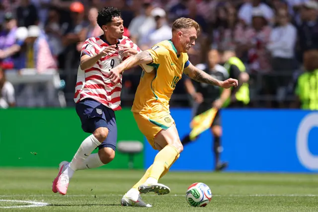 Harry Souttar controls the ball against Ricardo Pepi