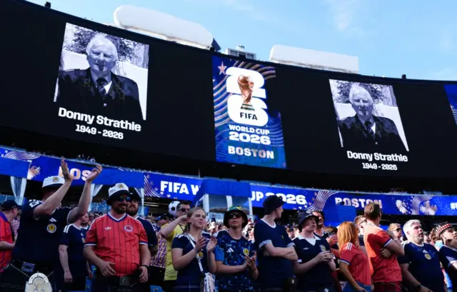 A tribute to Donny Strathie, a Scotland fan who died after collapsing at the Boston Norwood Hampton Inn, ahead of the FIFA World Cup Group C match at the Boston Stadium