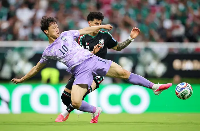 Jae-Sung Lee #10 of Korea Republic controls the ball against Jorge Sanchez #2 of Mexico during the FIFA World Cup 2026 Group A match between Mexico and Korea Republic