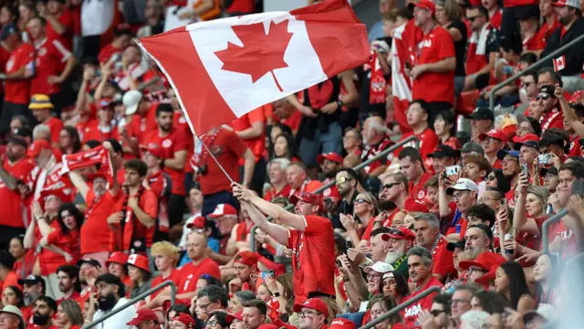 A fan of Canada waves a flag