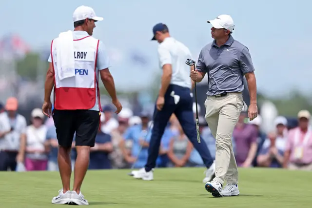 Rory McIlroy greets caddie Harry Diamond