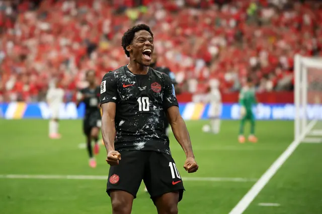Jonathan David #10 of Canada celebrates scoring his team's second goal during the FIFA World Cup 2026 Group B match between Canada and Qatar