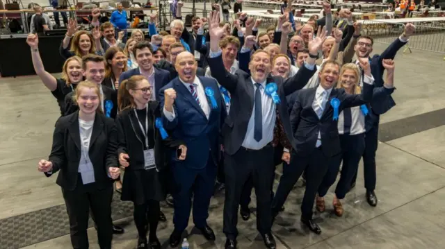 Scottish Conservative Party MSP Douglas Lumsden (front row centre) celebrates with supporters