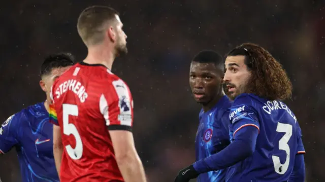 Jack Stephens of Southampton exchanges words with Marc Cucurella of Chelsea after an incident resulting in him receiving a red card