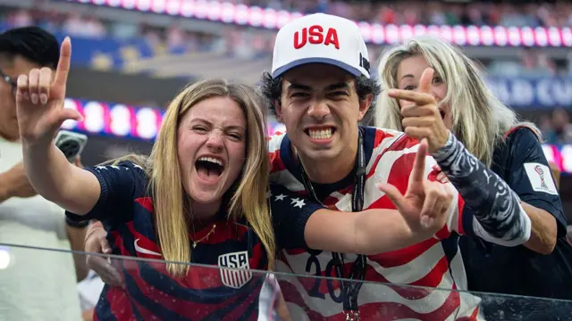 USA fans celebrate a goal against Paraguay
