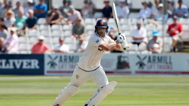 Tom Westley driving the ball for four for Essex