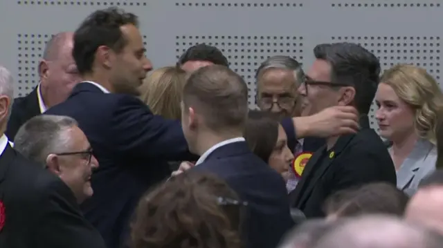 Andy Burnham and Josh Simons hugging