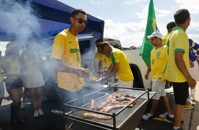 Brazil fans cooking on a barbecue