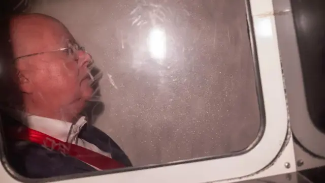 Peter Murrel shown behind a van window